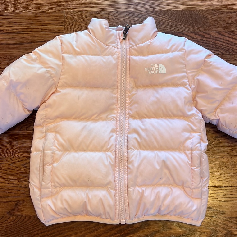 The North Face reversible girls toddler puffer jacket in pink. Size 4T.